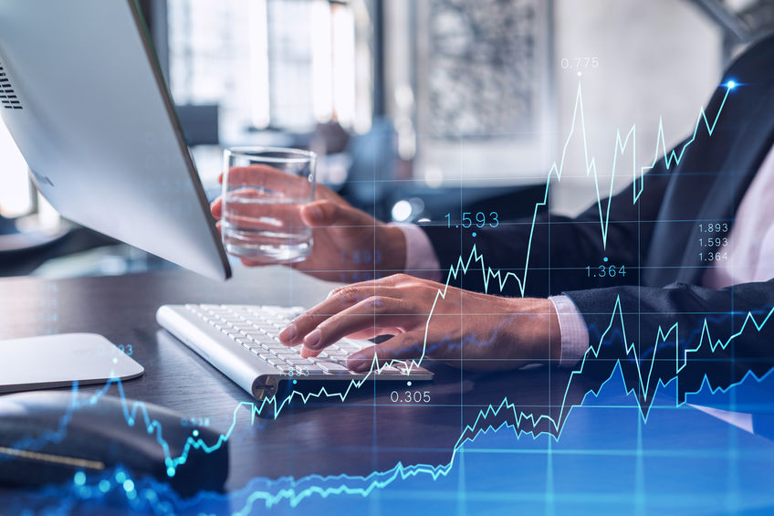 Hands typing the keyboard to research stock market to proceed right investment solutions. Internet trading and wealth management concept. Formal wear. Hologram Forex chart over close up shot.